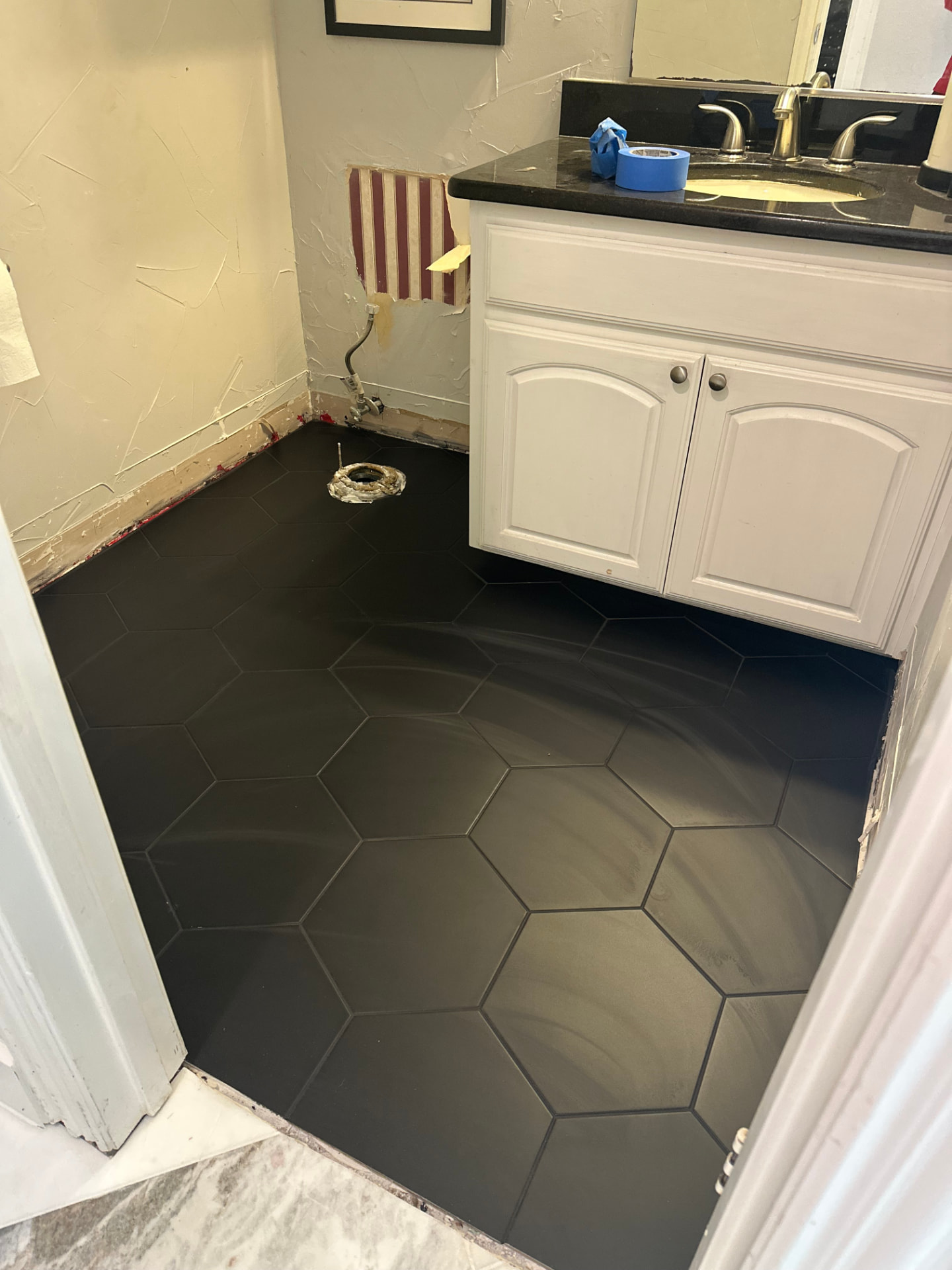 Bathroom renovation with full-height tile work and new fixtures