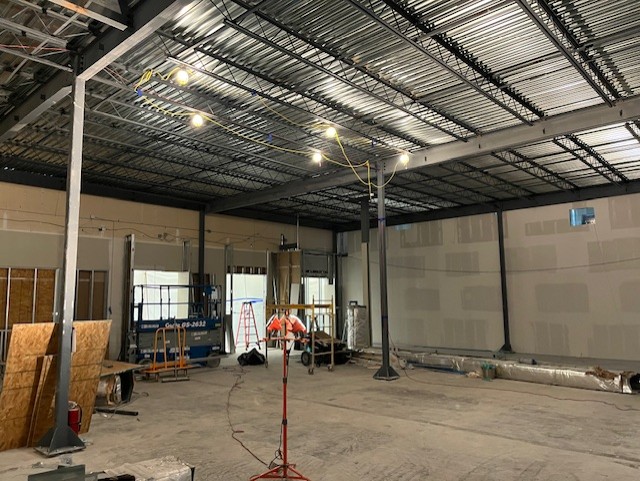 Structural steel columns and beams erected inside a warehouse shell